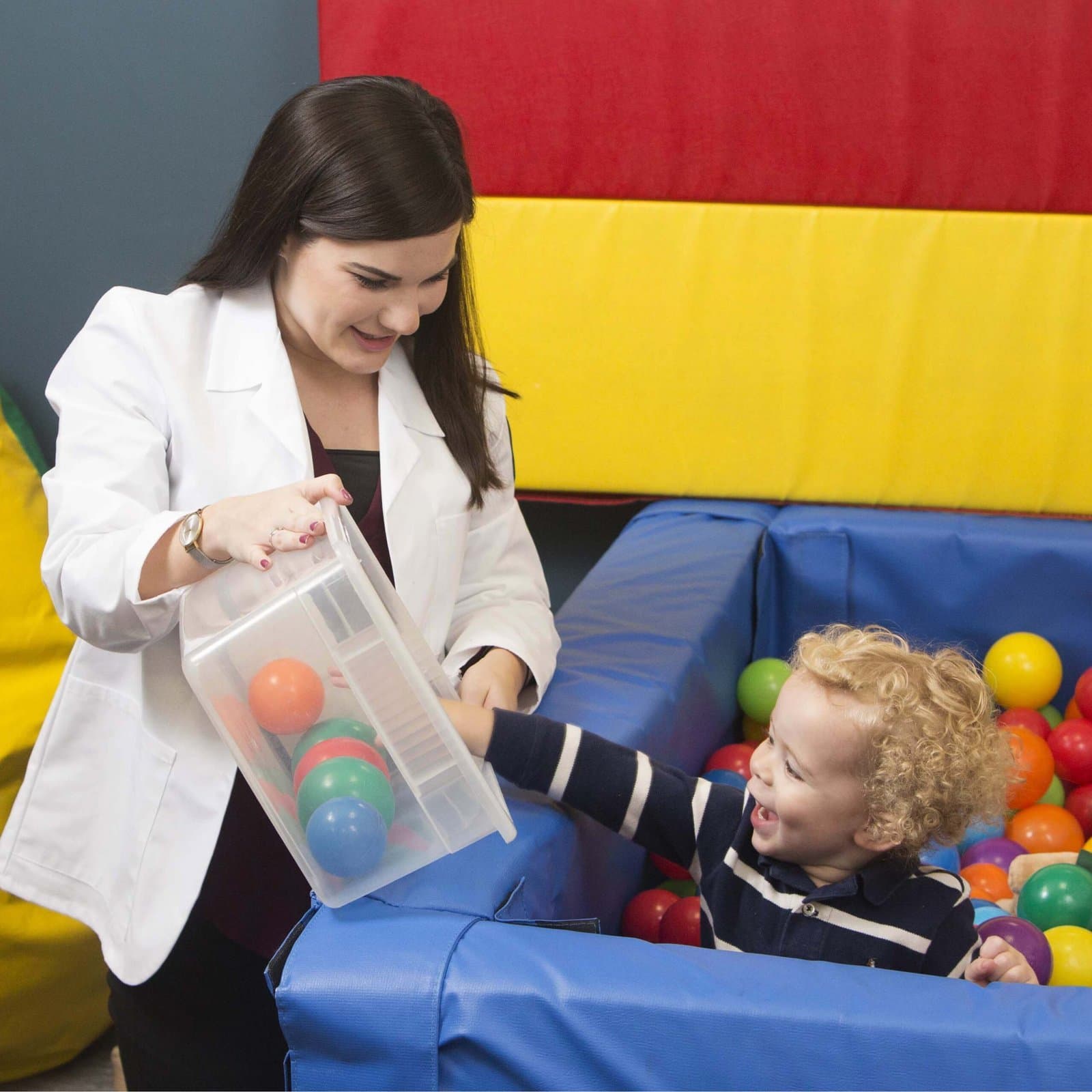 KidStart pediatric therapist working with a child during a therapy session